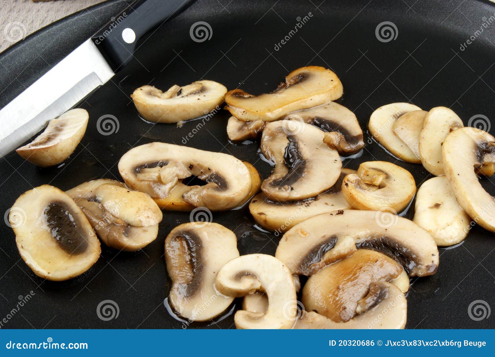 Grilled mushrooms in a pan stock photo. Image of split 20320686