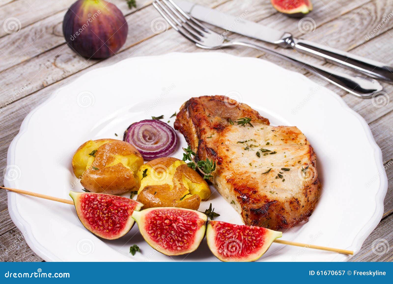 Grilled Pork Chop with Figs on Scewer, Crisp Roasted Potatoes and Thyme. Stock Image Image of