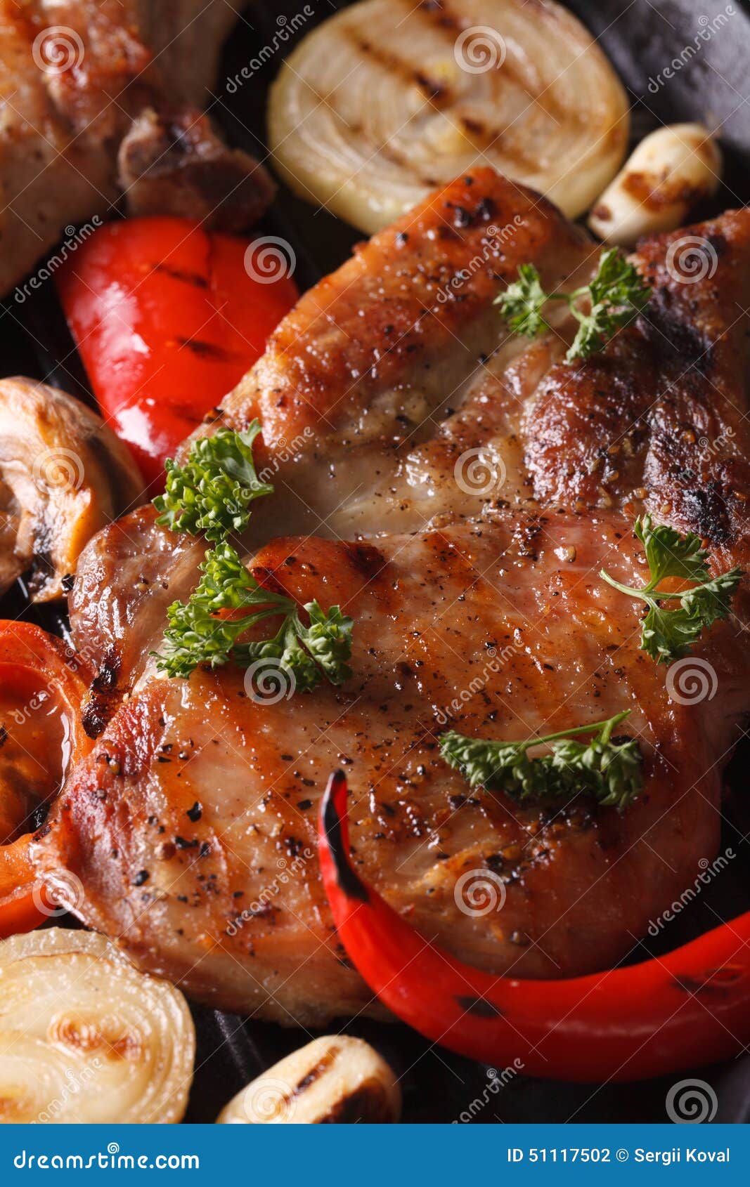 Grilled Pork Steak with Vegetables Top View Macro Vertical Stock Photo