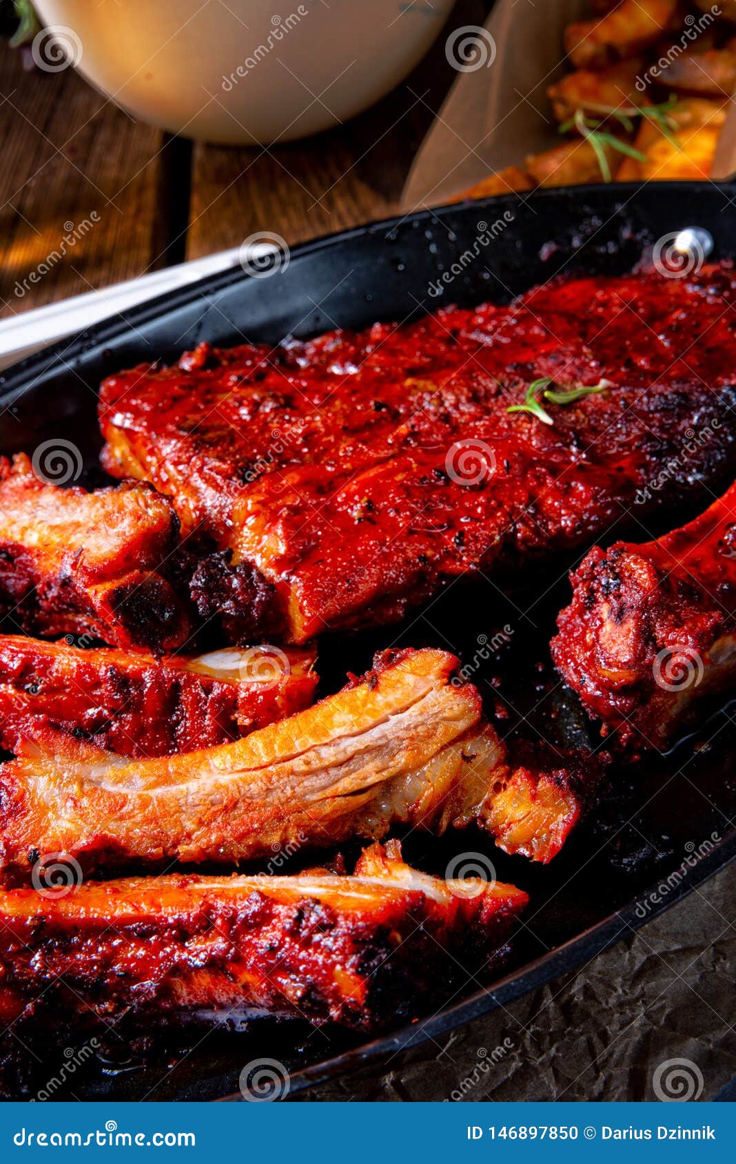 A Grilled Ribs in Spicy Marinade with Salad and Vegetables Stock Photo