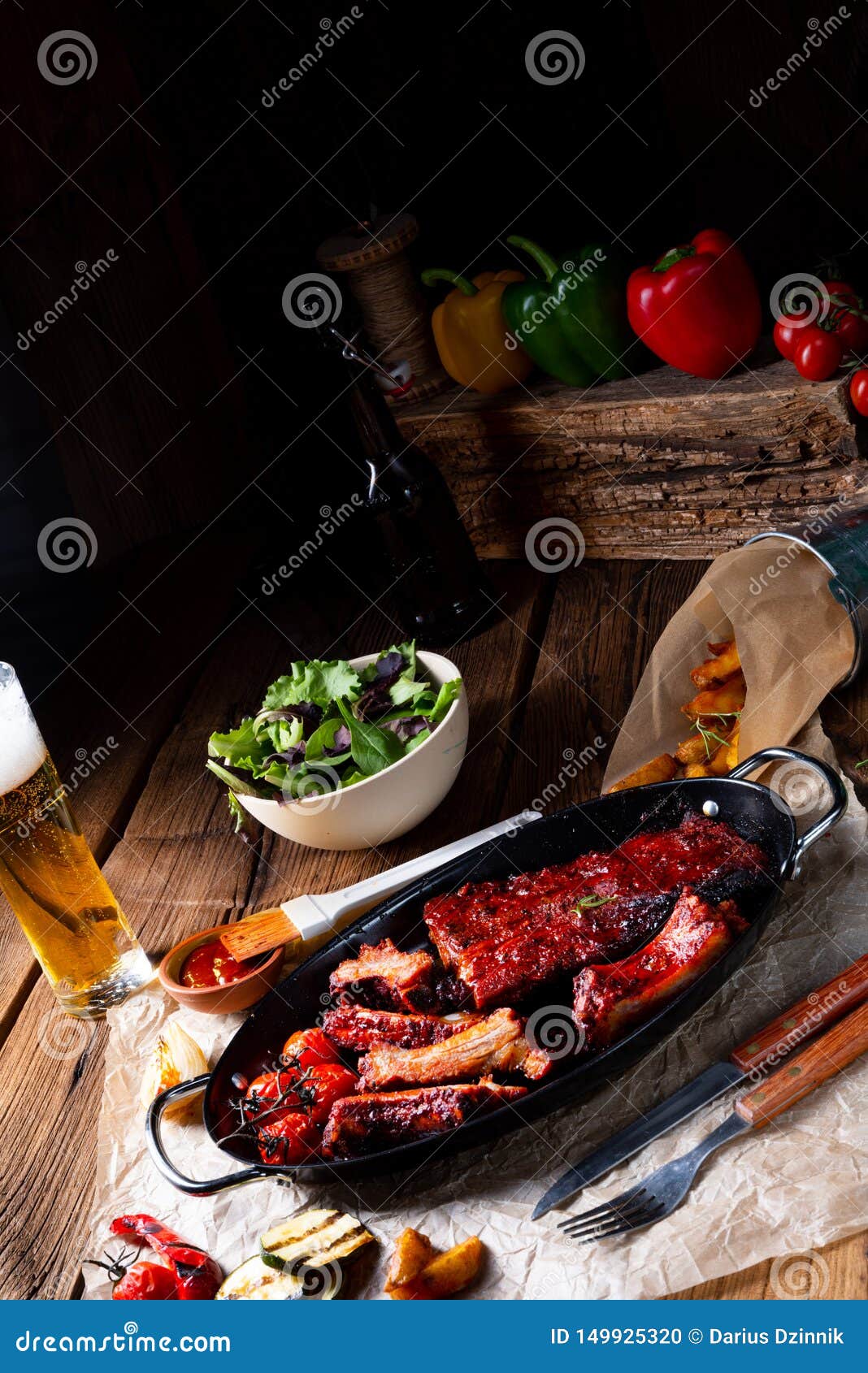 Grilled Ribs in Spicy Marinade with Salad and Vegetables Stock Photo
