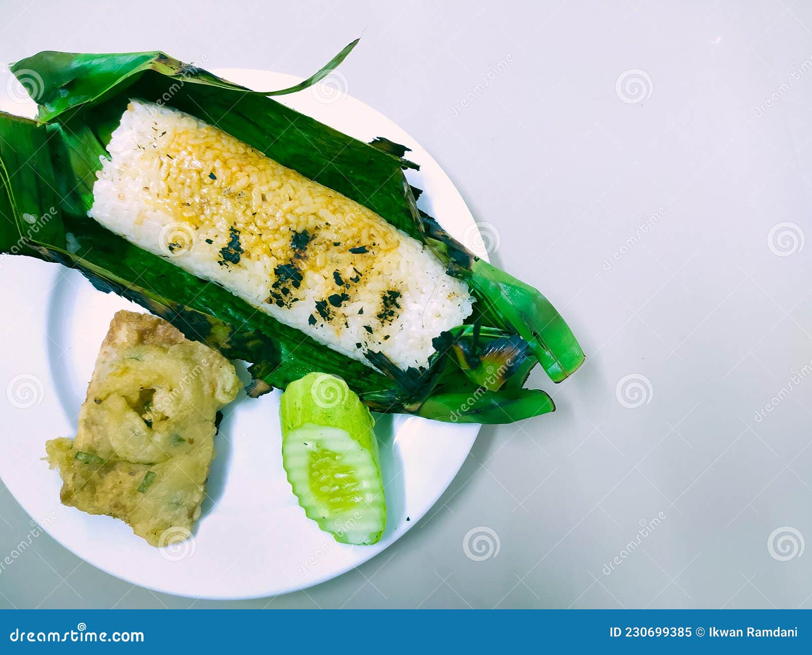 Grilled rice with fried tempeh wrapped in wheat flour