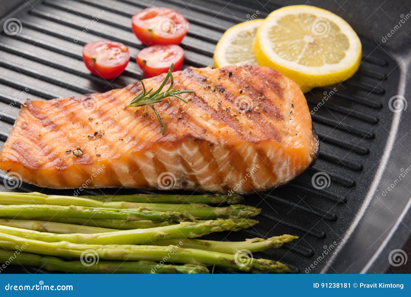 grilled salmon cooked bbq on a pan on wooden background