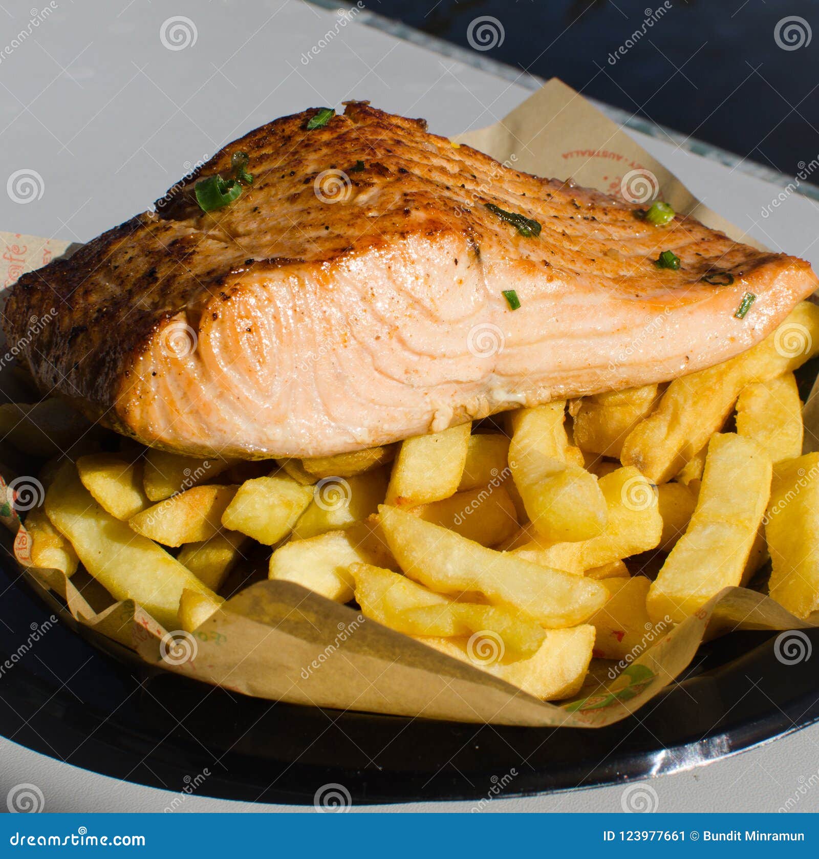 Grilled Salmon Fish with Chips on a Black Plastic Plate. Stock Image -  Image of fast, chip: 123977661