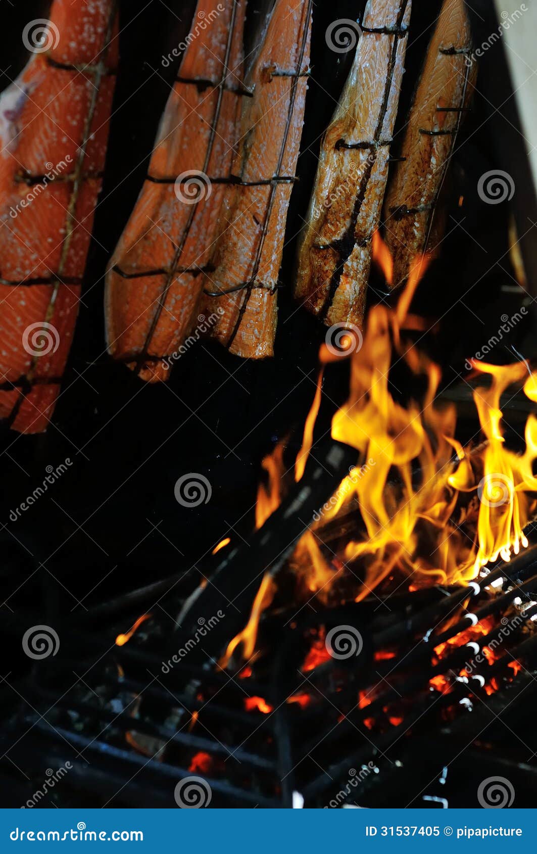 Grilled salmon under fire stock image. Image of gourmet 31537405