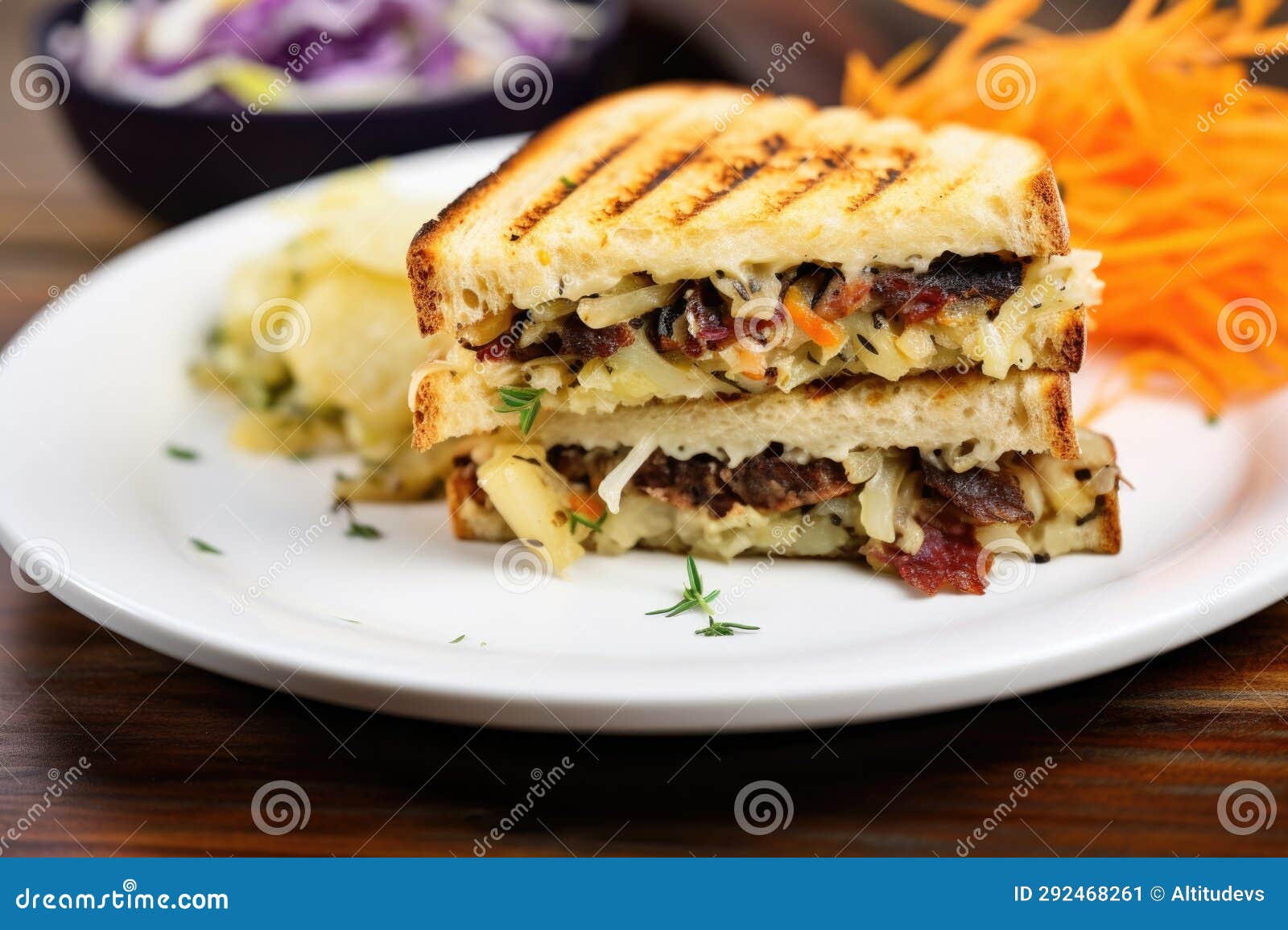 Grilled Sandwich with Sauerkraut Side View on White Plate Stock
