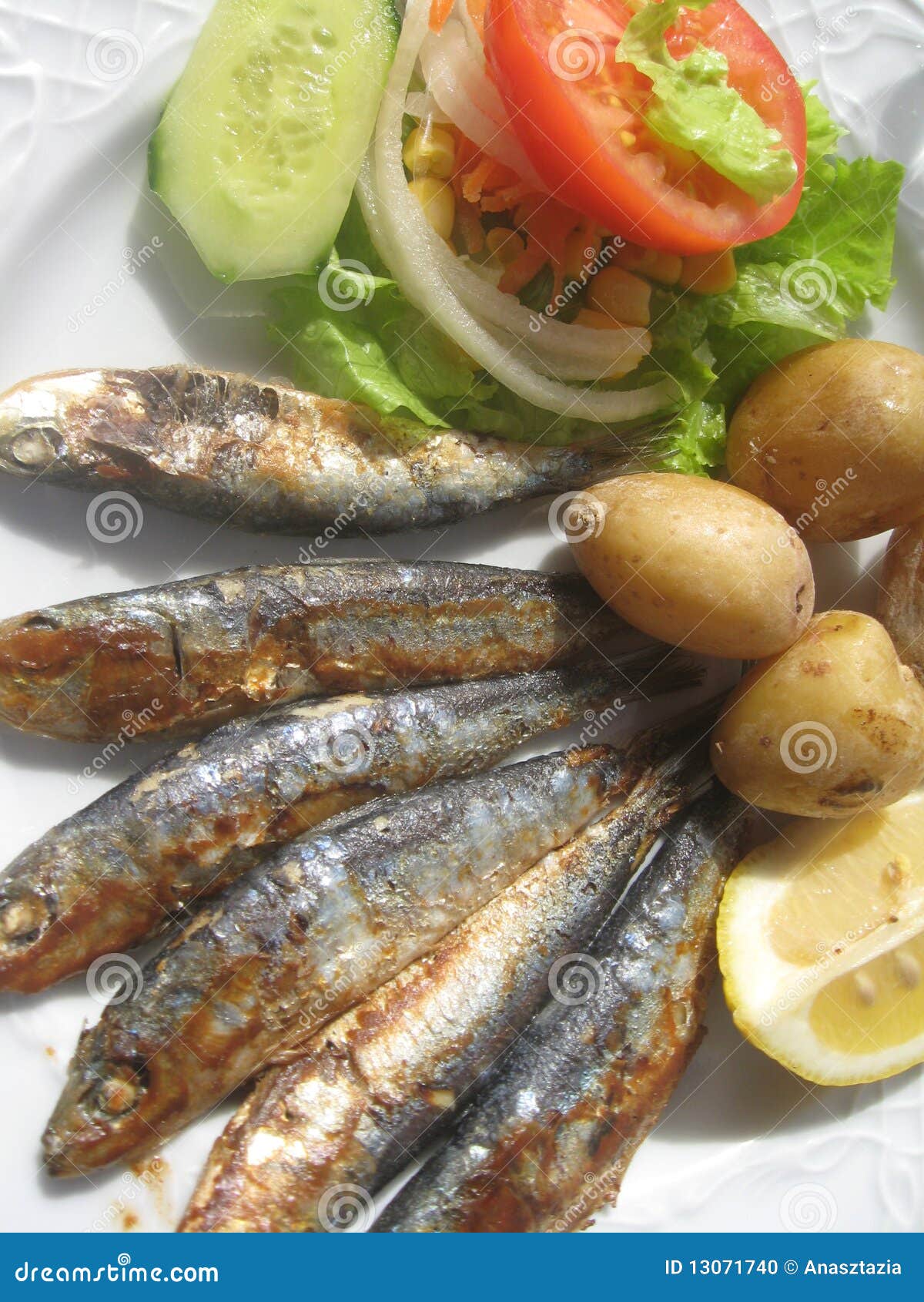 Grilled sardines stock photo. Image of corn, lemon, cucumber 13071740