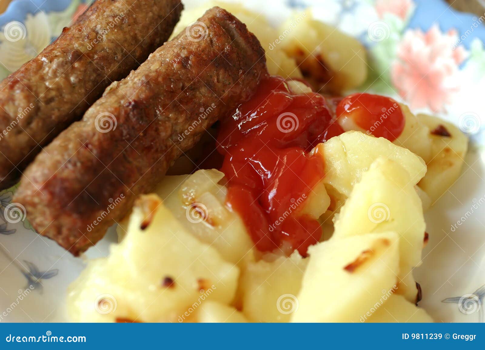 grilled sausages and coocked potatoes
