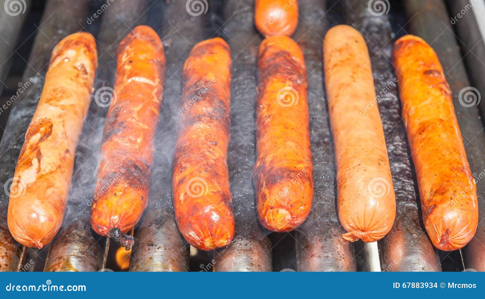 Grilled Sausages Roll on Heating Machine. Stock Photo Image of dogs