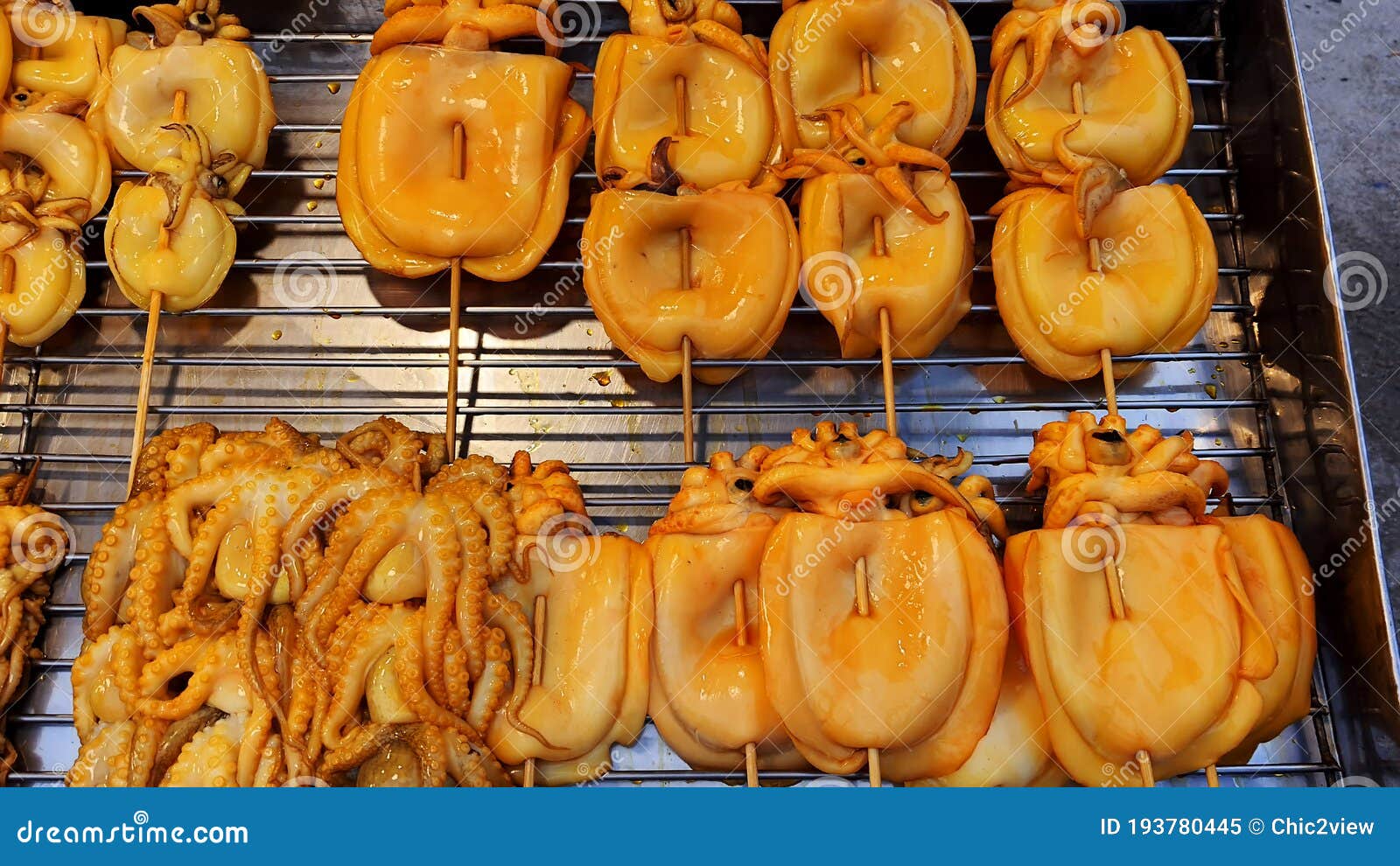 pix Grilled Squid On A Stick grilled squid popular street food in thailand bbq squid on a stick grilled buttered fresh squid many of grilled squid in thai mark stock image image of meat asia 193780445