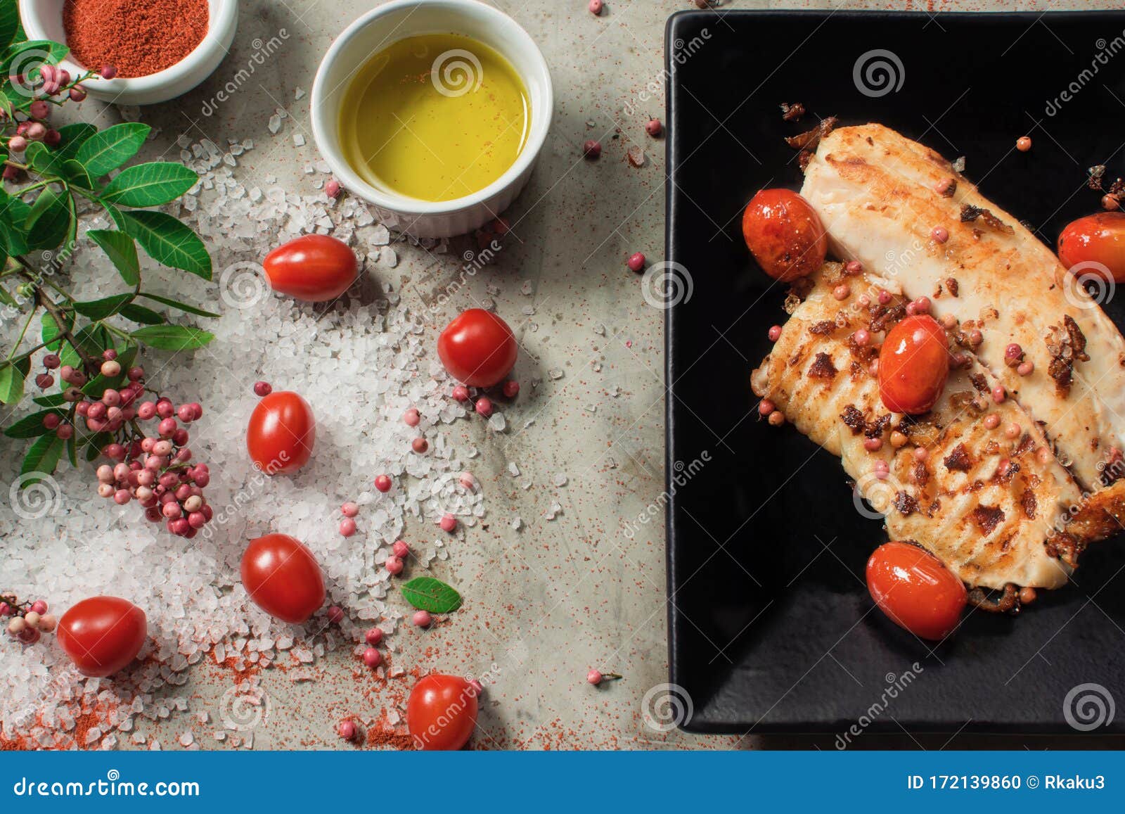 Grilled Tilapia Fillet and Ingredients Seen from Above Stock Photo