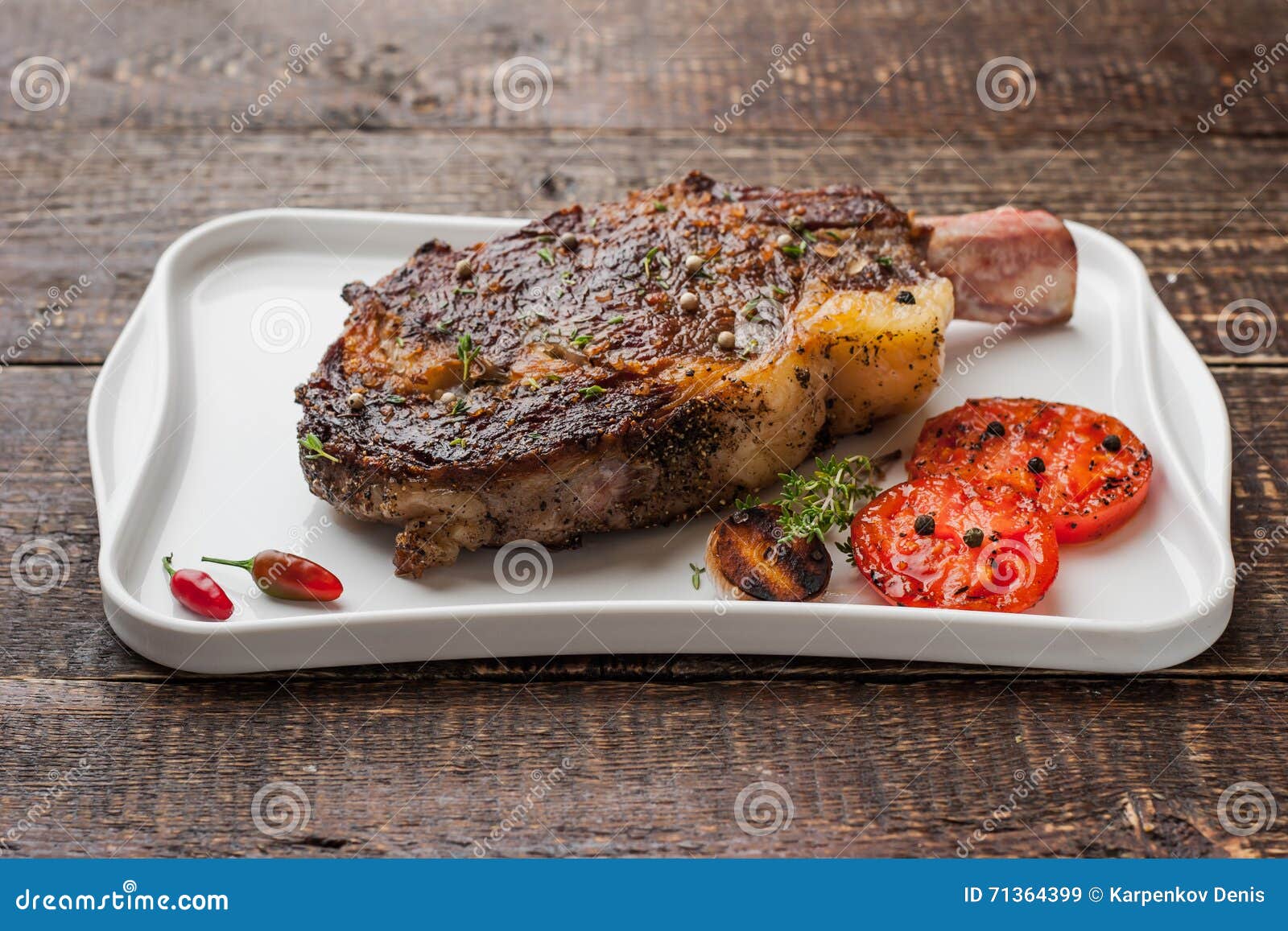 Grilled Tomahawk Steak On The Bone On A Ceramic Plate Stock Image
