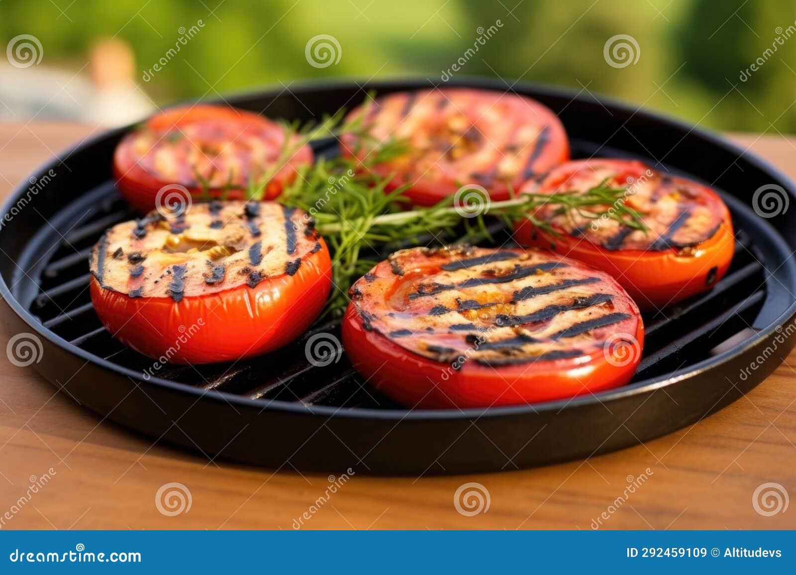 Grilled Tomatoes with Grill Marks on a Ceramic Plate Stock Image