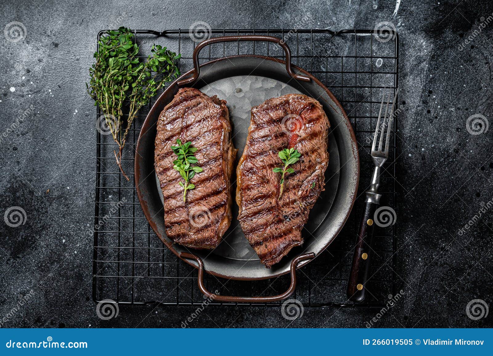 Grilled Top Blade or Flat Iron Beef Meat Steaks. Black Background Stock
