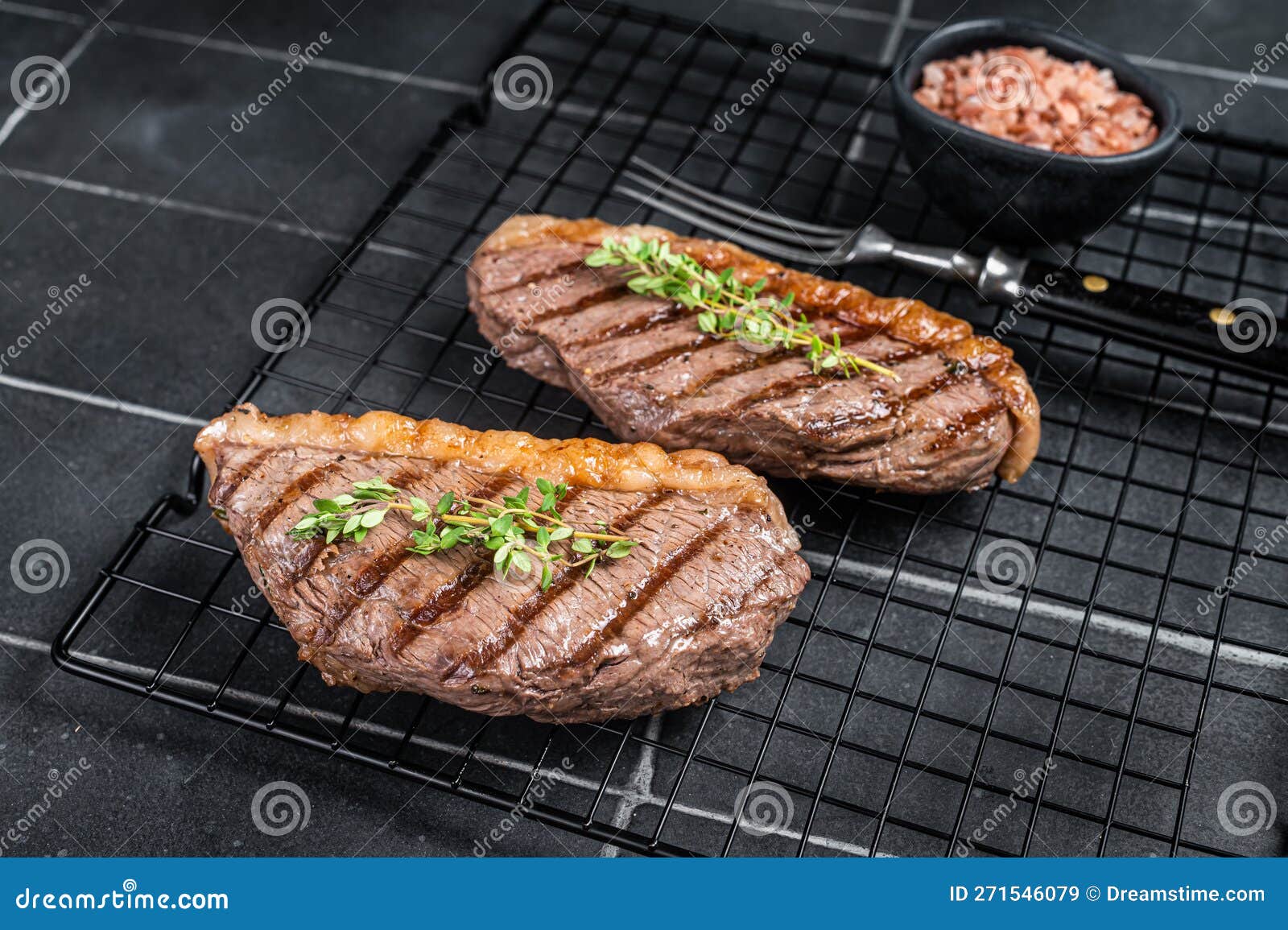 Grilled Top Sirloin or Cup Rump Beef Meat Steak on a Rack. Black