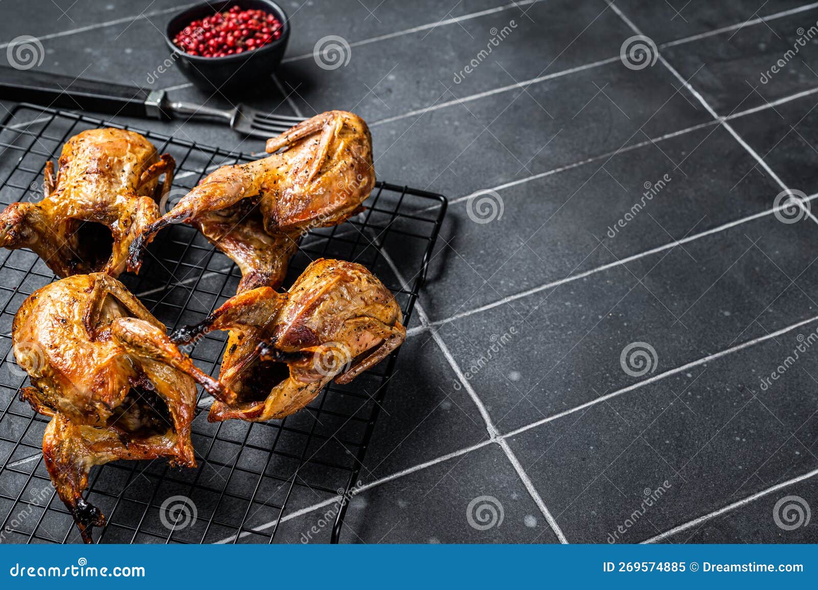 Grilled Whole Quails with Herbs and Spices. Black Background. Top View