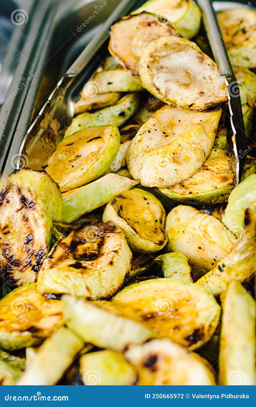 grilled zucchini with addition of thyme, lemon zest and garlic