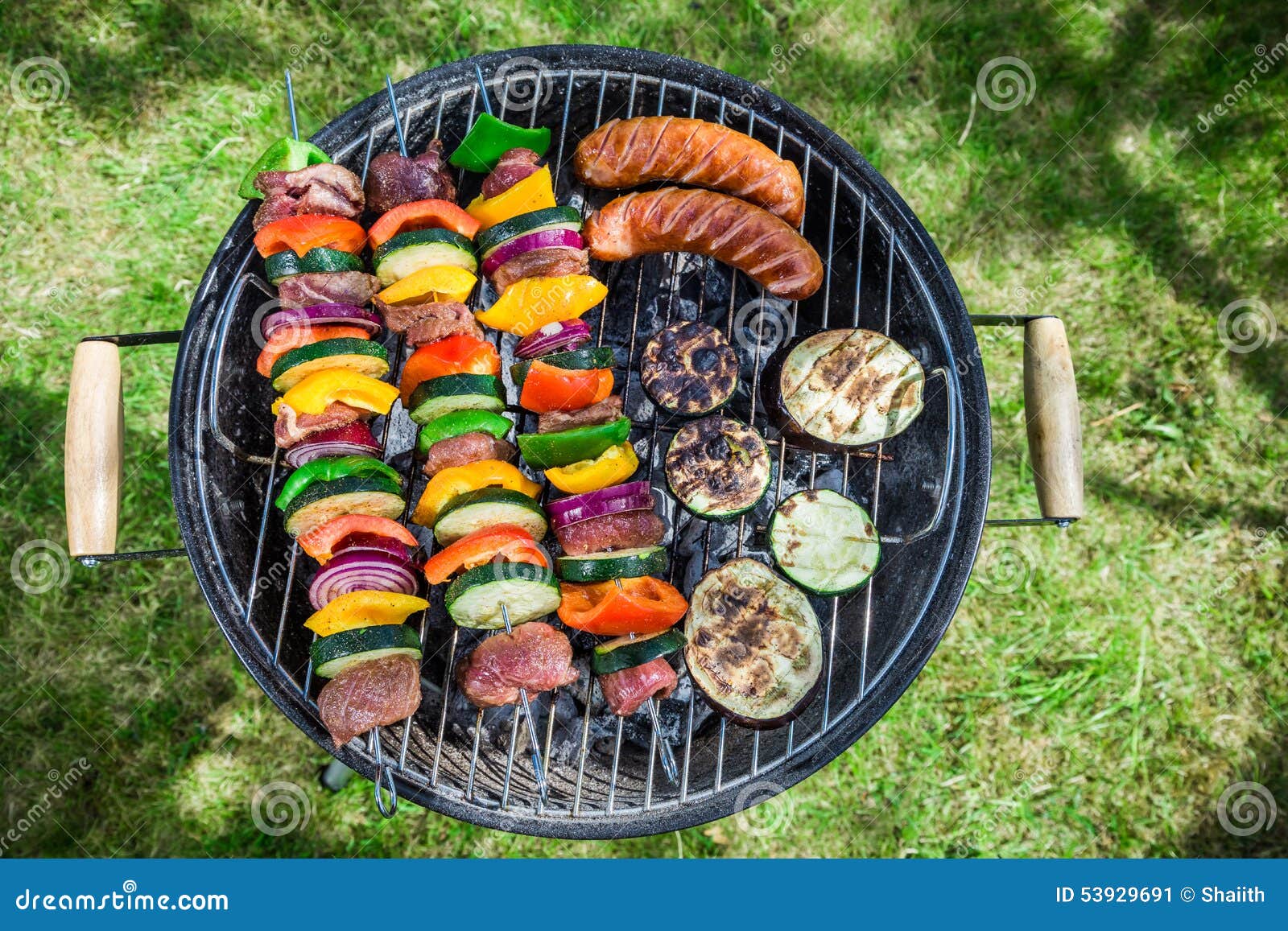 Grilling Fresh Vegetables and Meat with Herbs in Garden Stock Image