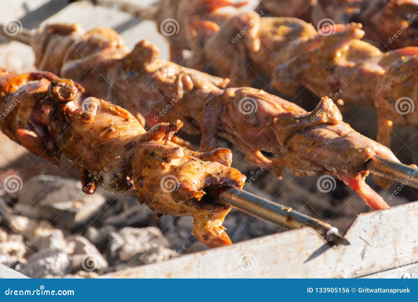 Grilling Quails Over Charcoal Stove Stock Photo Image of quails, gourmet 133905156