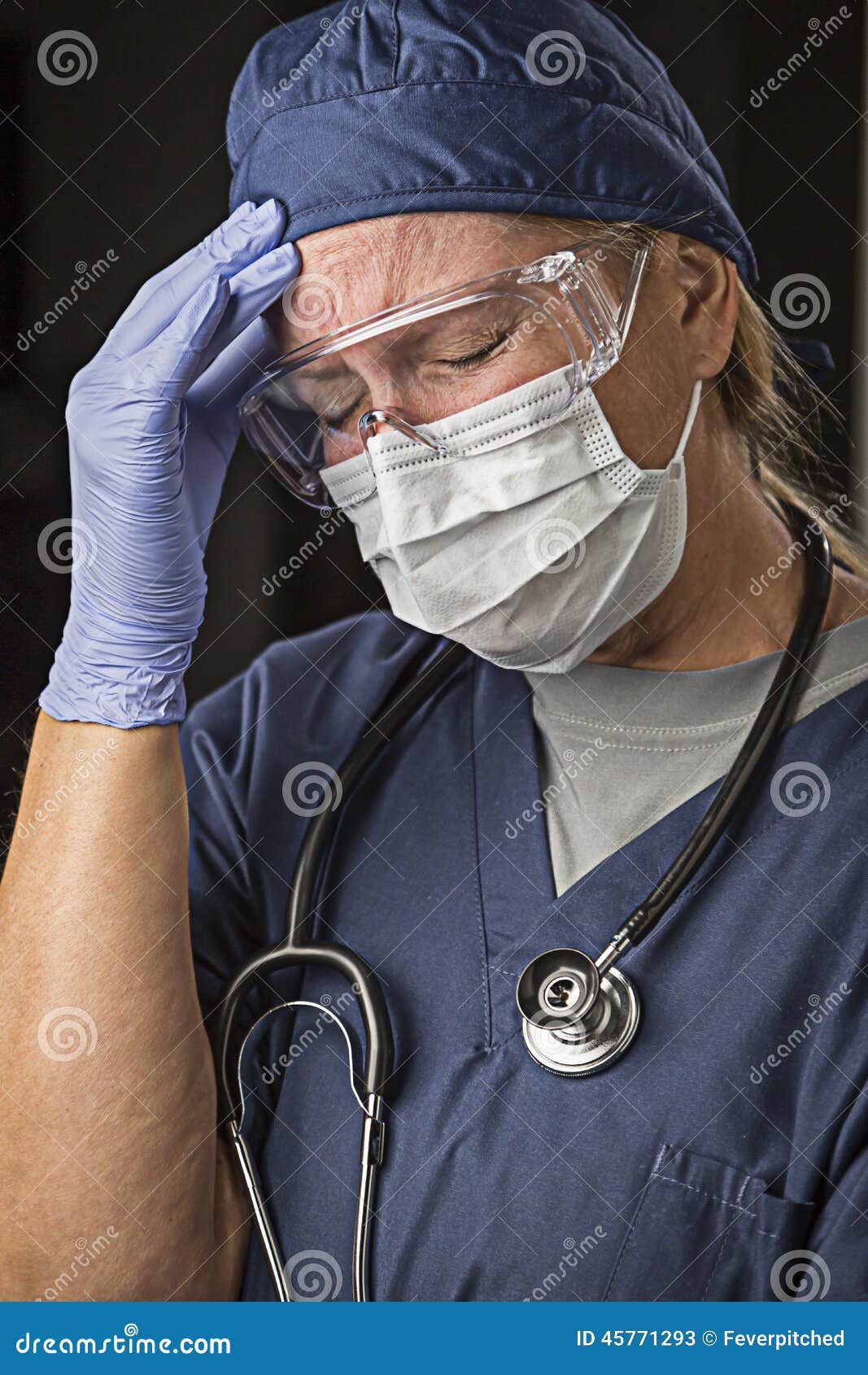 Grimacing Female Doctor or Nurse Wearing Protective Wear. Grimacing Female Doctor or Nurse Wearing Protective Facial Wear and Surgical Gloves.