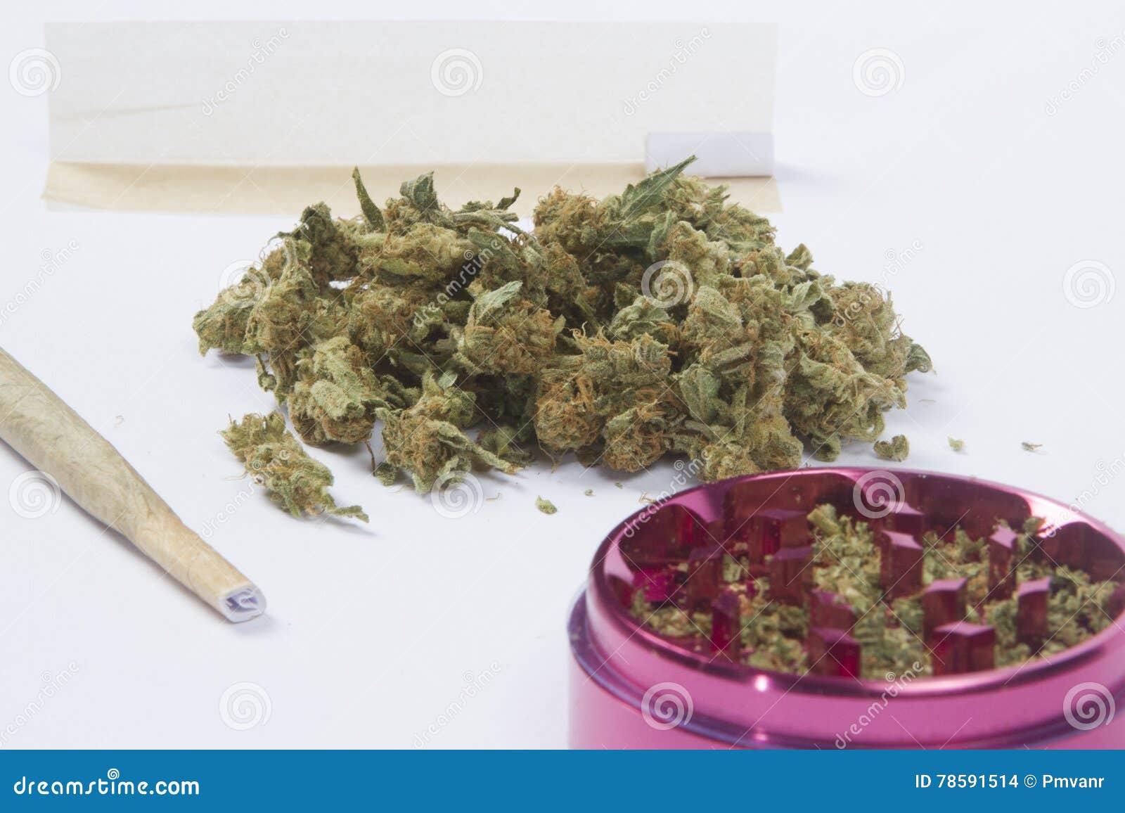 Grinder, skins and weed stock photo. Image of rolling 78591514