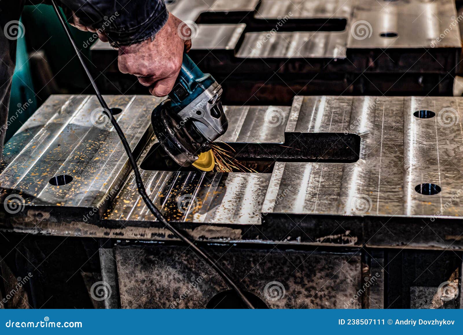 Grinding Burrs and Metal with an Angle Grinder with Sparks Stock Image