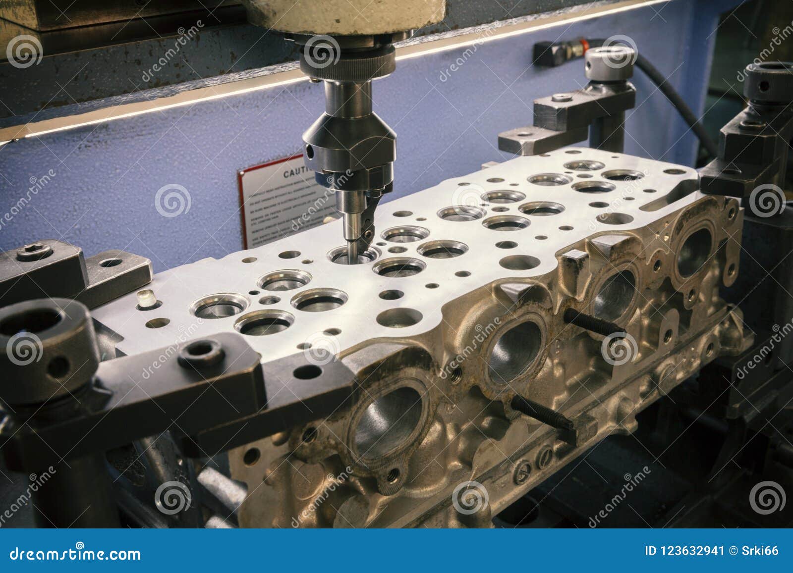 Grinding cylinder head stock image. Image of machine 123632941