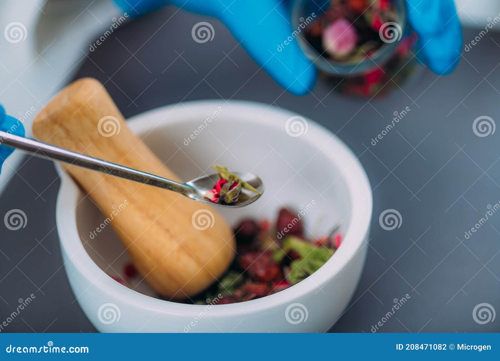 Grinding Herbs and Flowers Using Mortar and Pestle Stock Photo Image