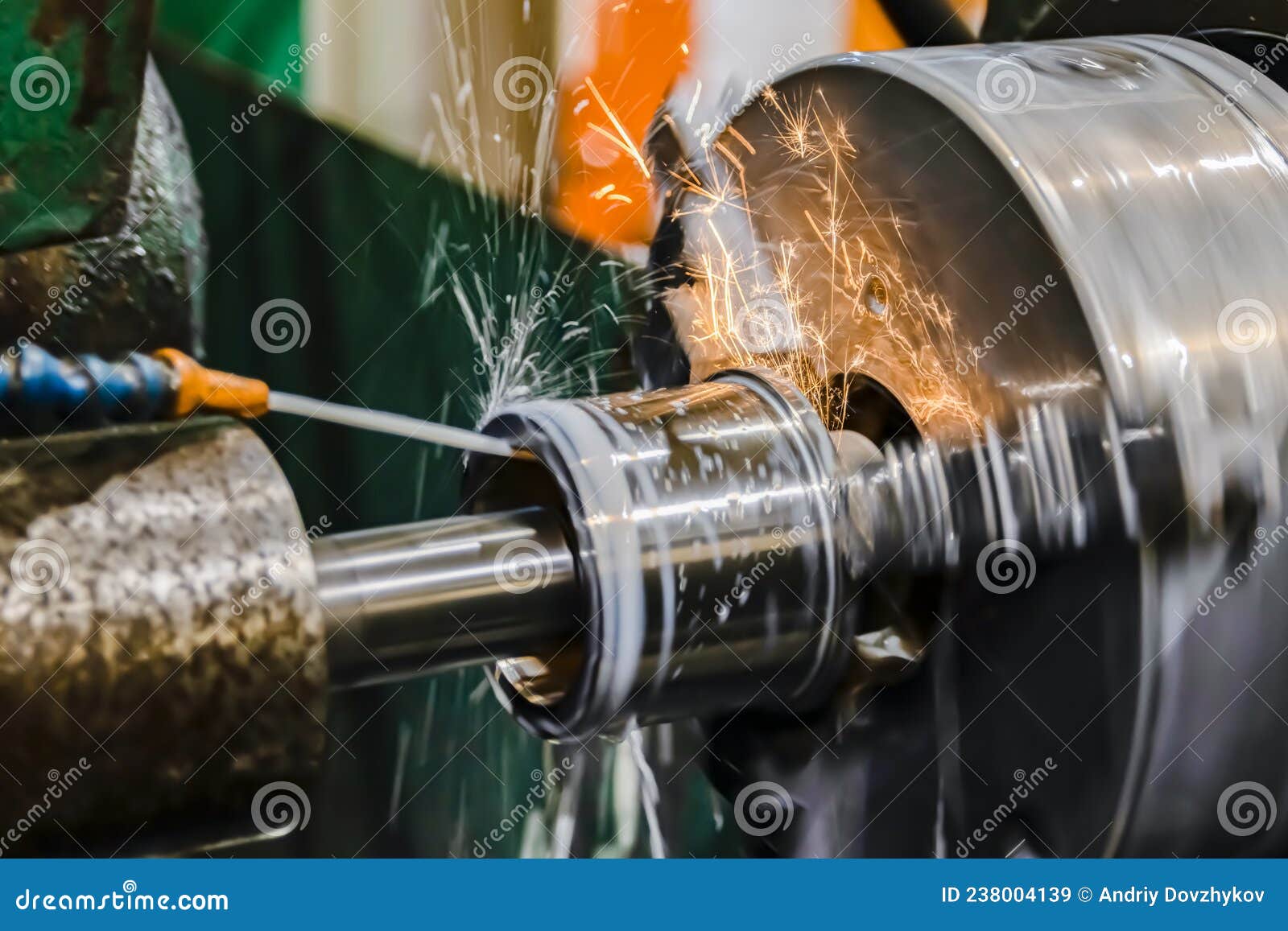 Grinding the Hole on a Cylindrical Grinder with Coolant Stock Image