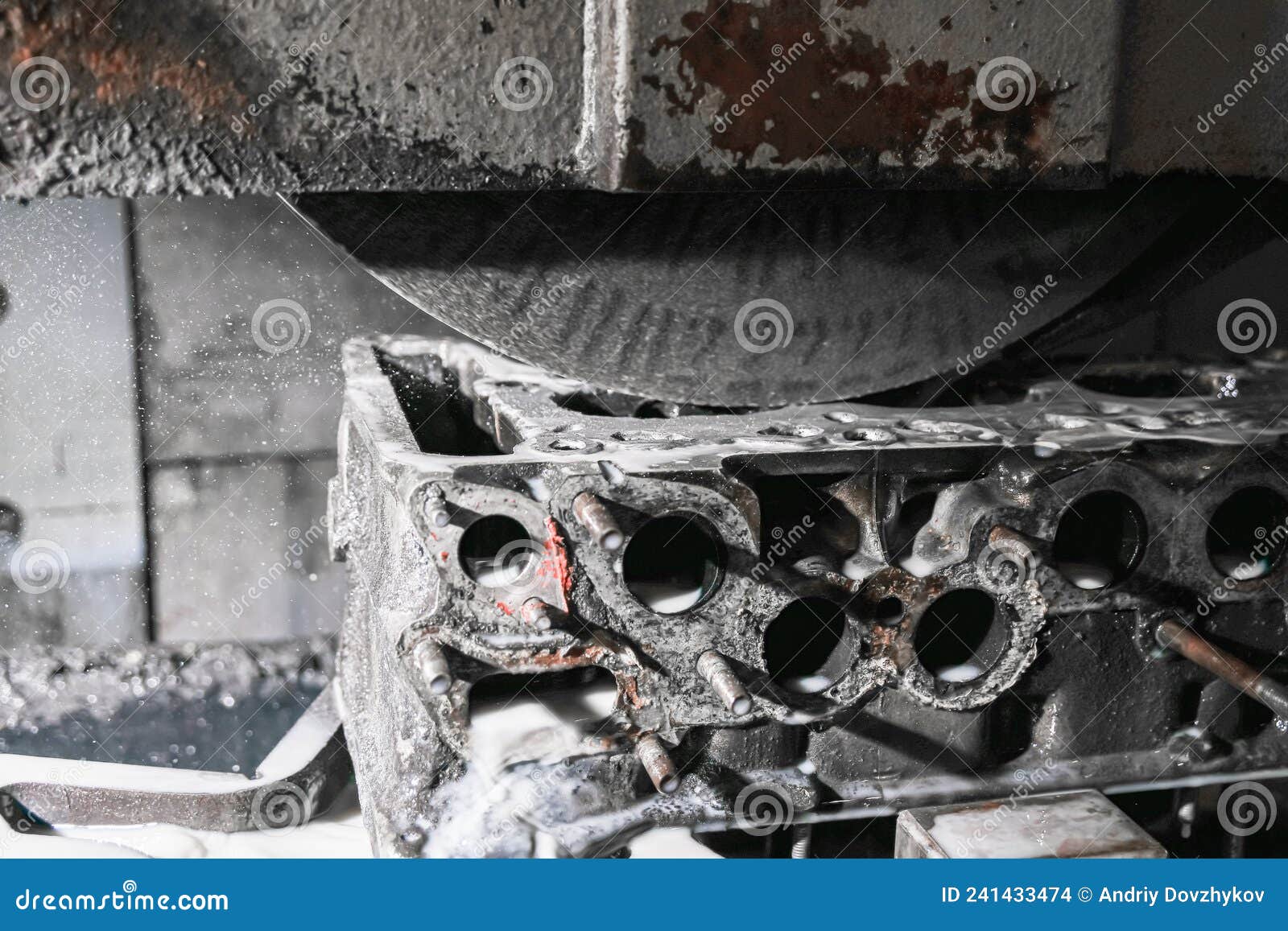 Grinding the Surface of the Cylinder Head on a Surface Grinder Stock