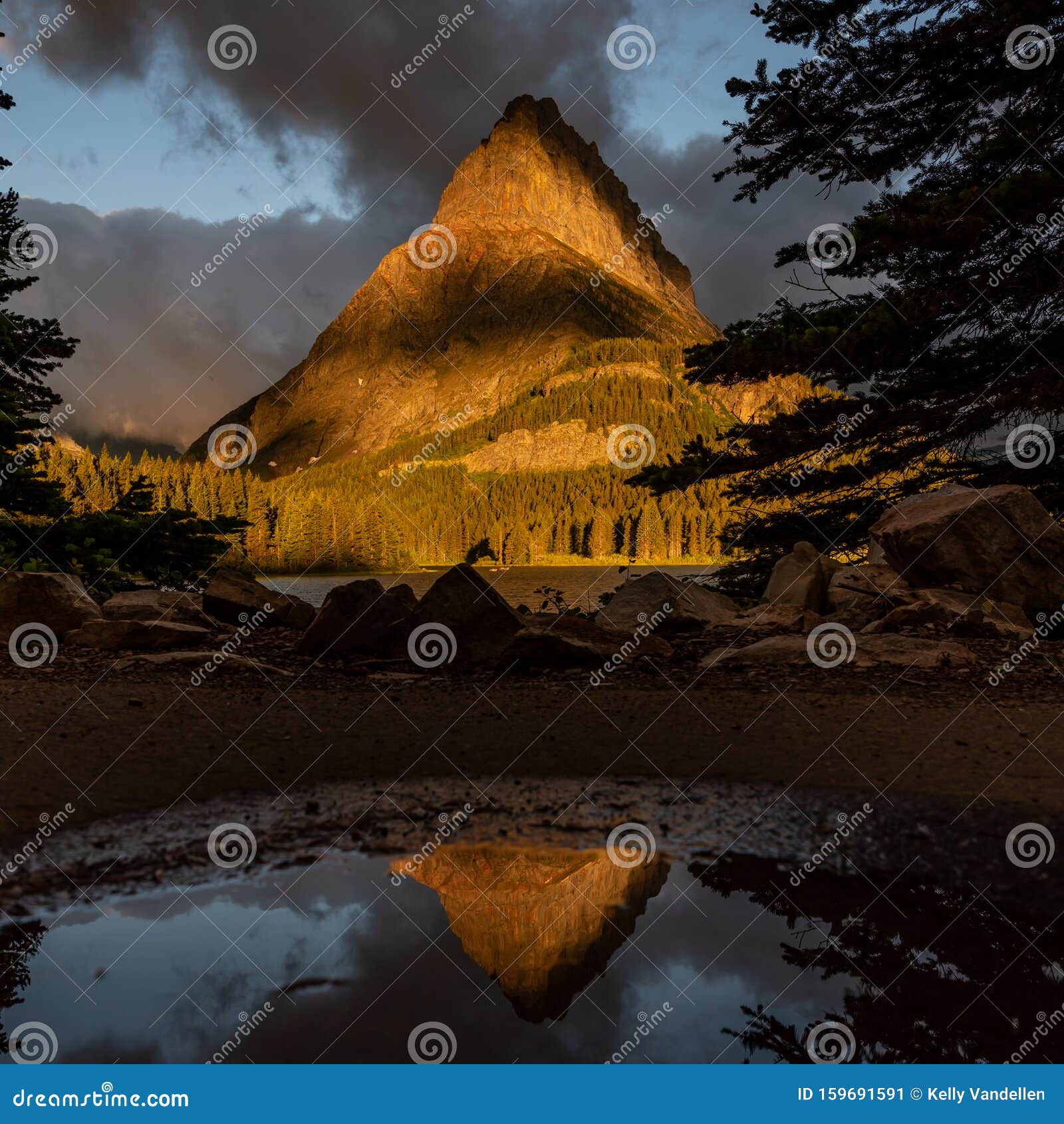 grinnell point reflects in puddle