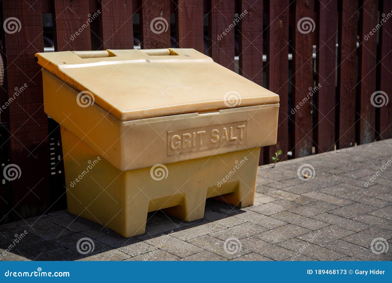Grit Salt Yellow Bin Near Wall Stock Photography
