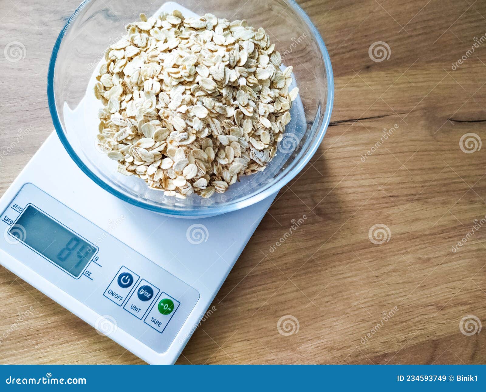 https://thumbs.dreamstime.com/z/grits-weighing-glass-bowl-kitchen-scales-wooden-table-oat-groats-electronic-234593749.jpg