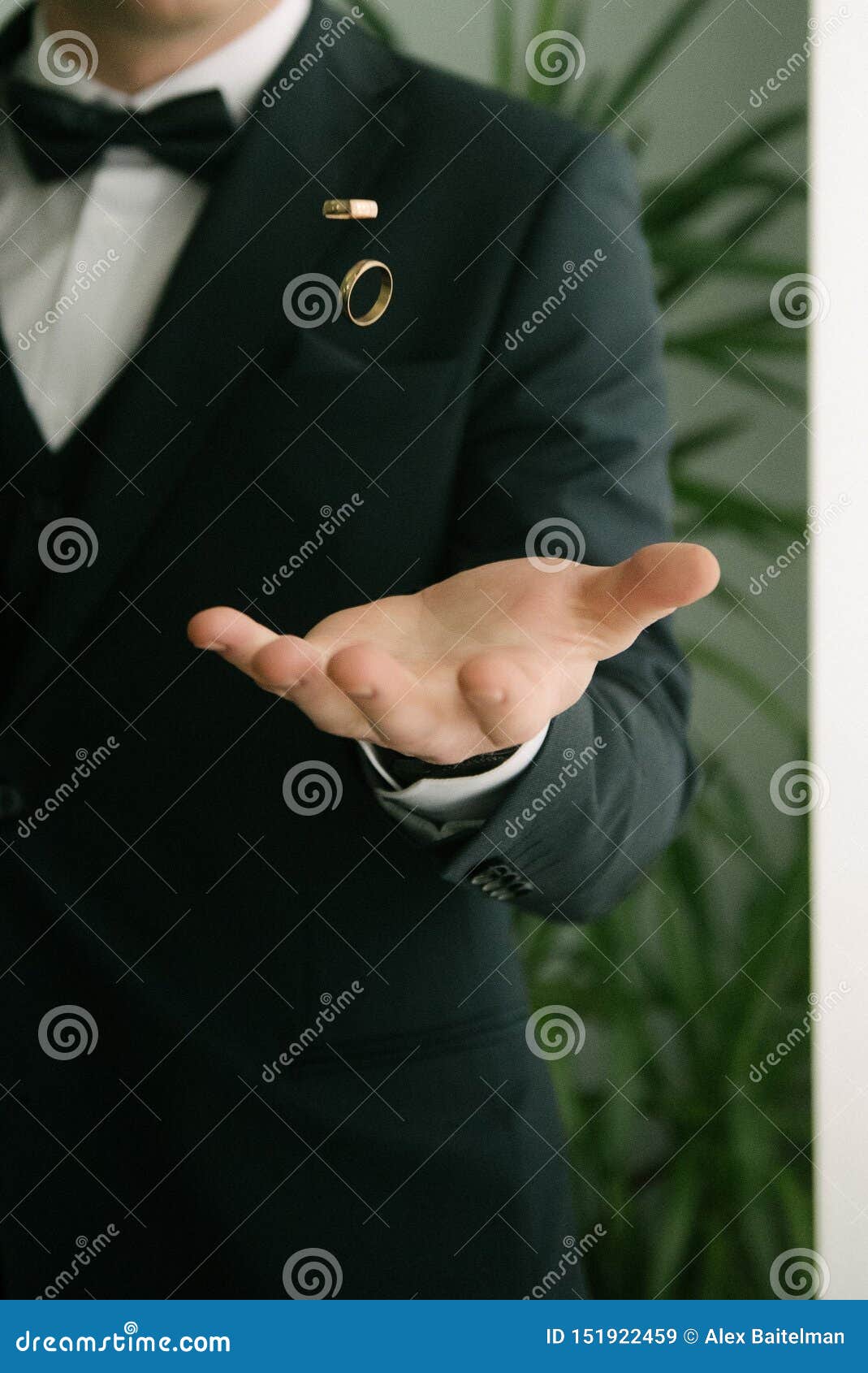 Groom Throws Up Wedding Rings. Groom Throws Rings by Hand Stock Image
