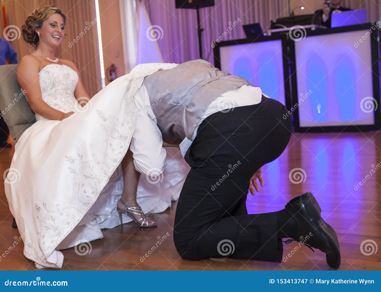 Groom Under Brides Dress Taking Off Garter Stock Image Image Of Groom