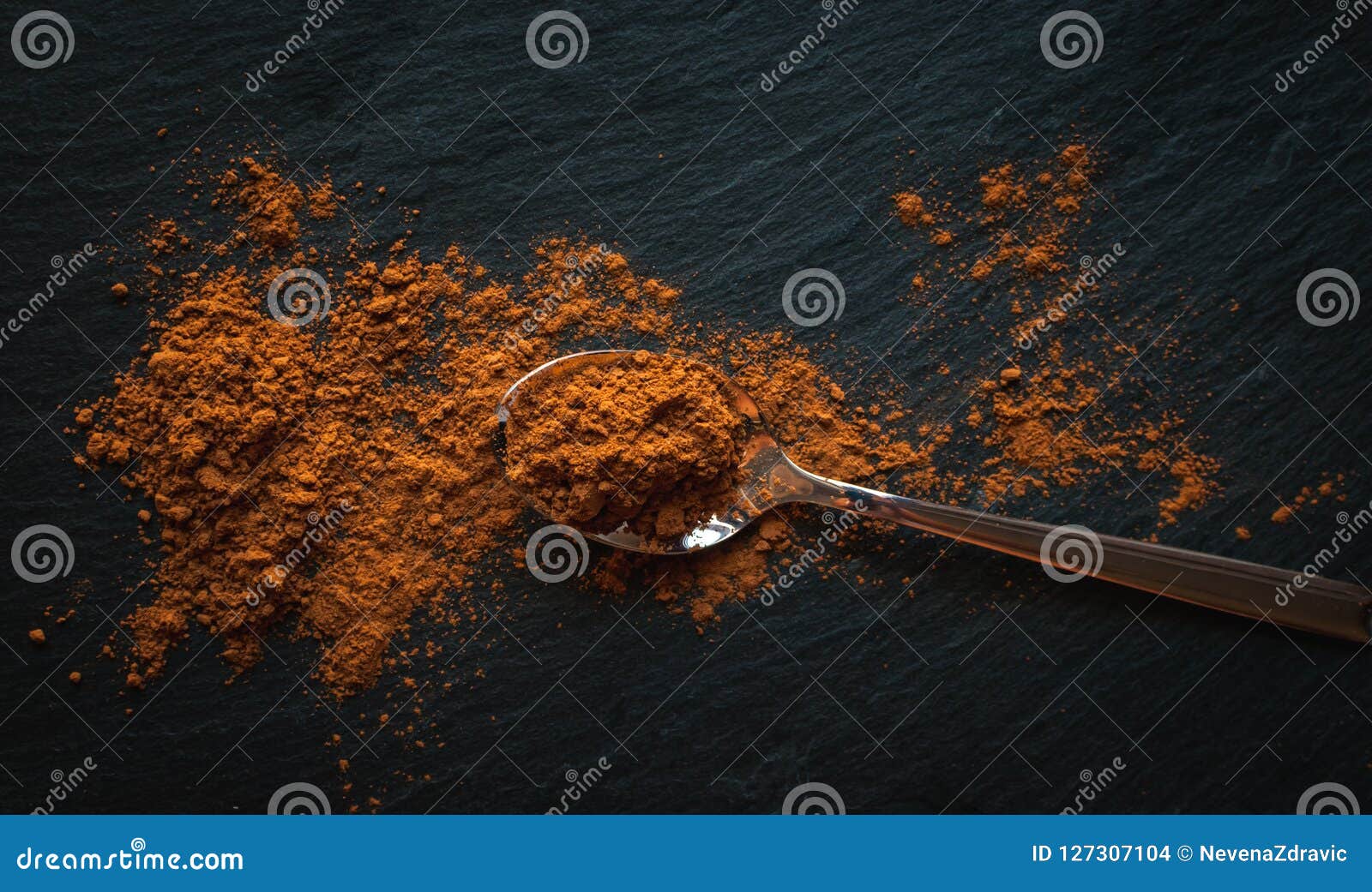 Ground Cinnamon In Teaspoon On Dark Background, Top View, Text Space