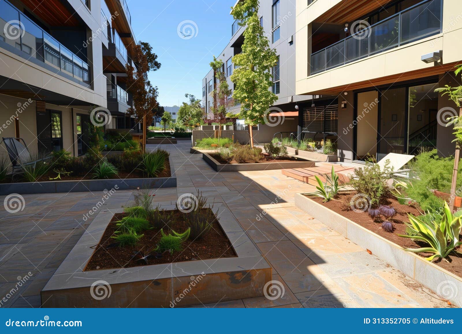 Ground Floor Patios with Privacy Landscaping at a Deluxe Complex Stock