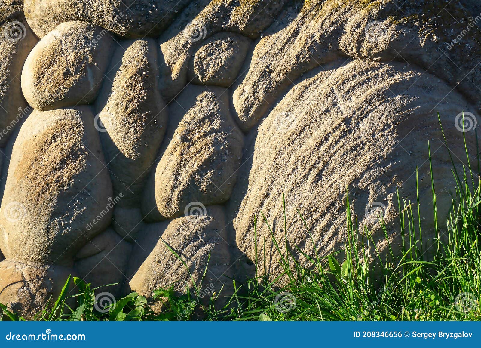 a large  wavy-d stone stands on the ground