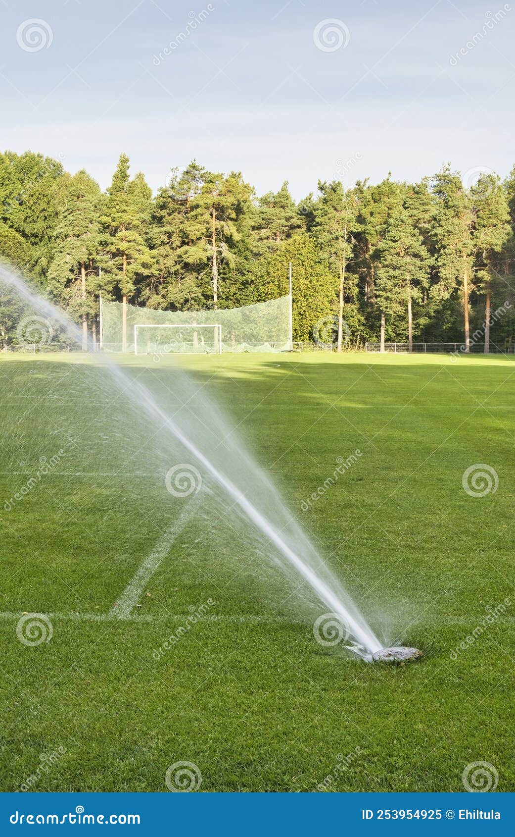 Inground Sprinkler System Watering the Sports Field Stock Image