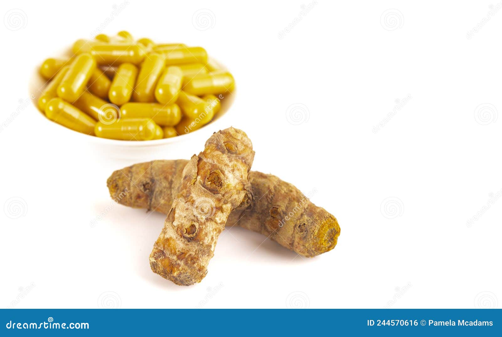 Ground Turmeric in Capsule Form on a White Background Stock Photo
