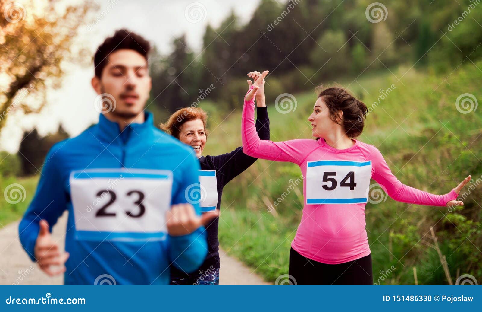 A Group of Multi Generation People Running a Race Competition in Nature