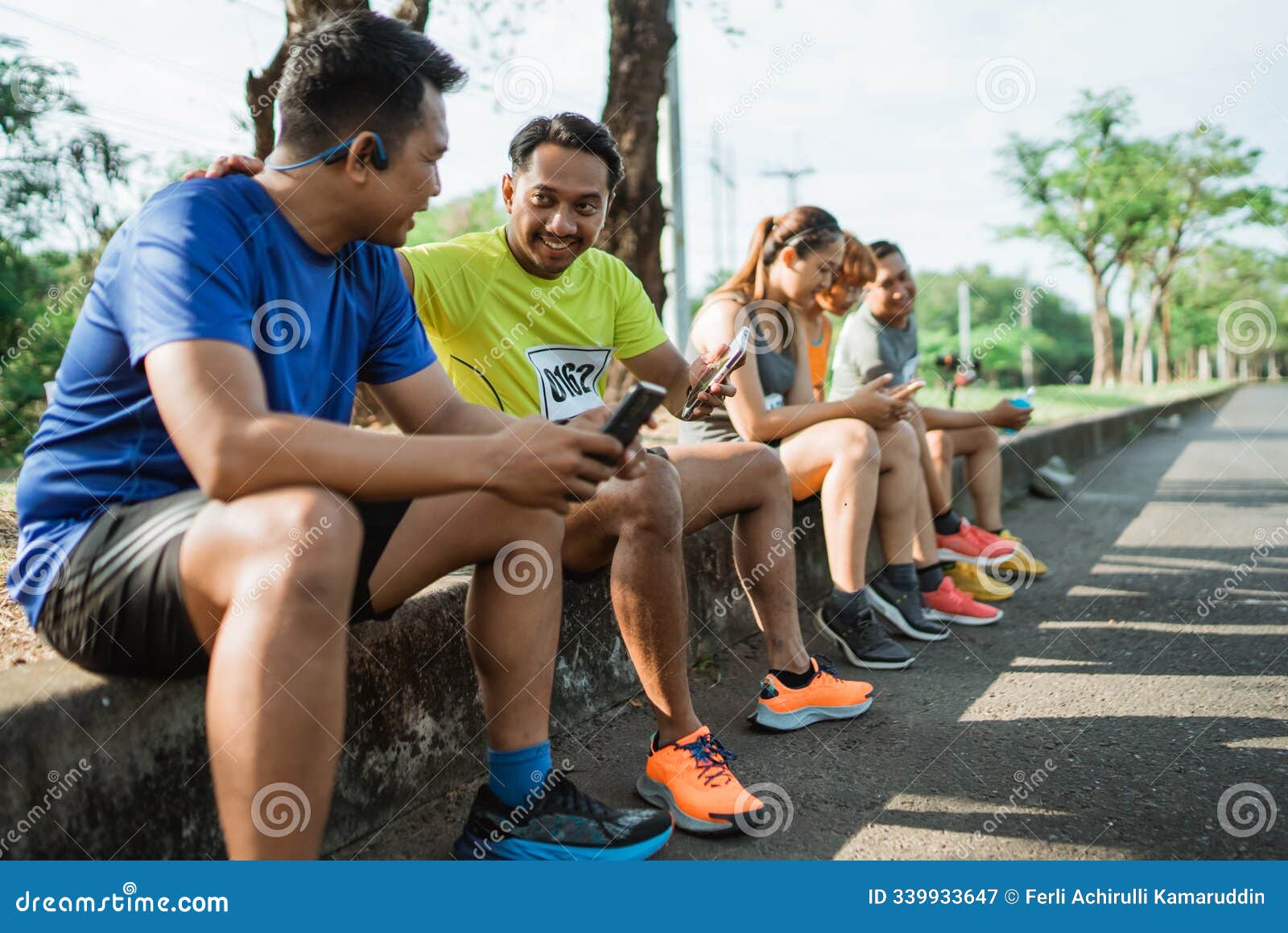 group athlete taking break after running