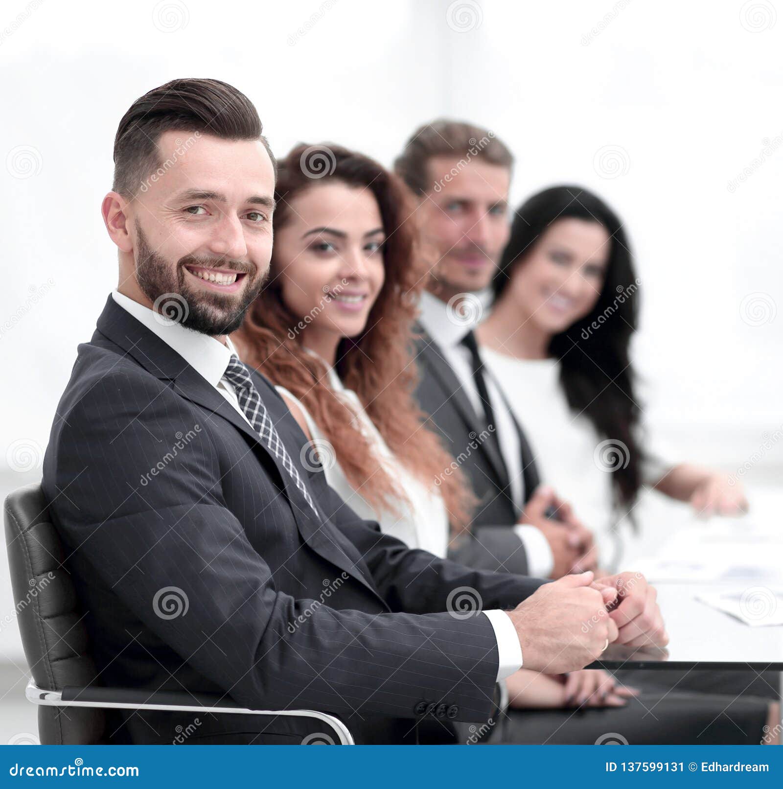 Group of Business People Sitting at the Desktop Stock Image - Image of