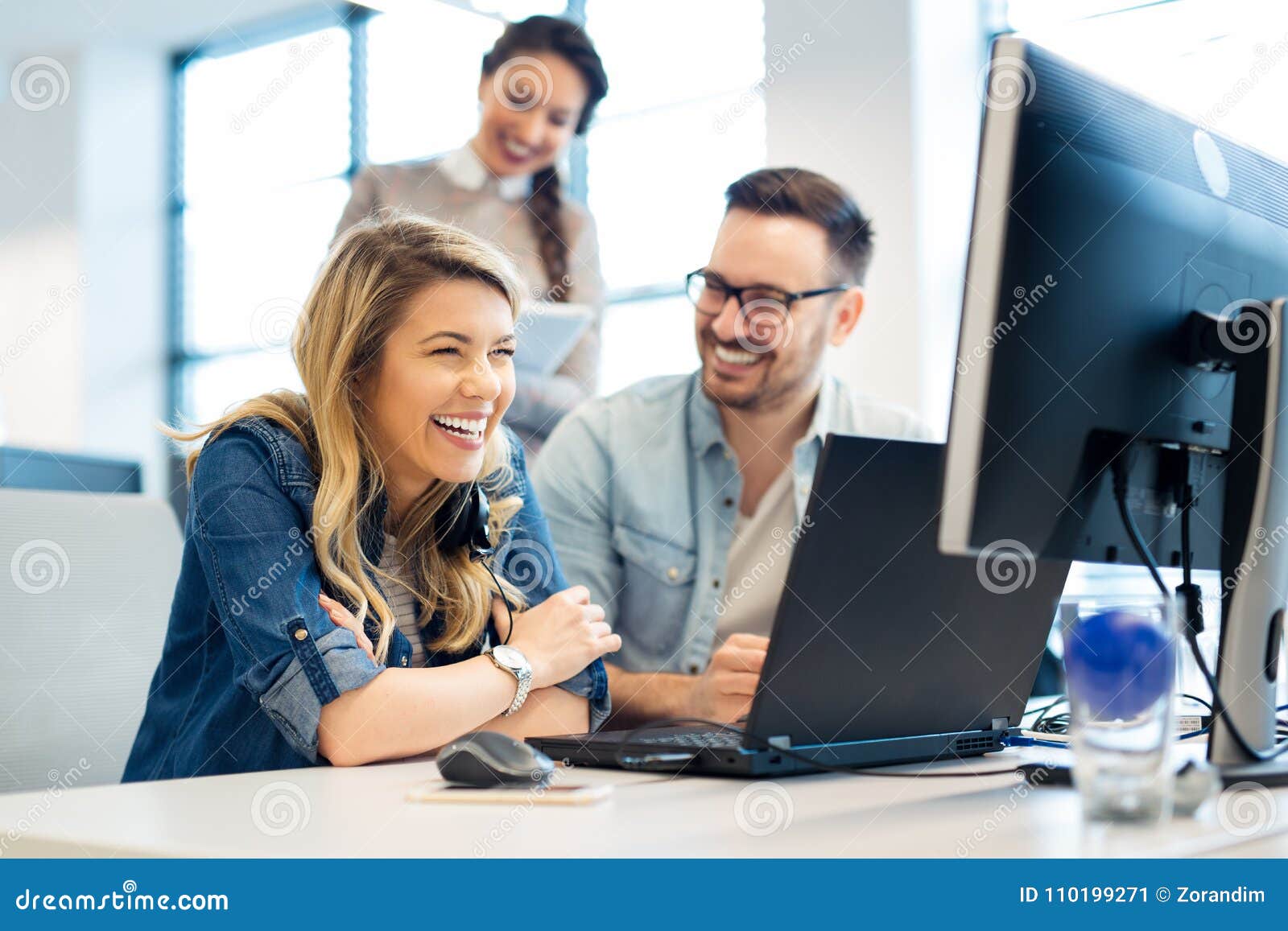 group of business people and software developers working as a team in office