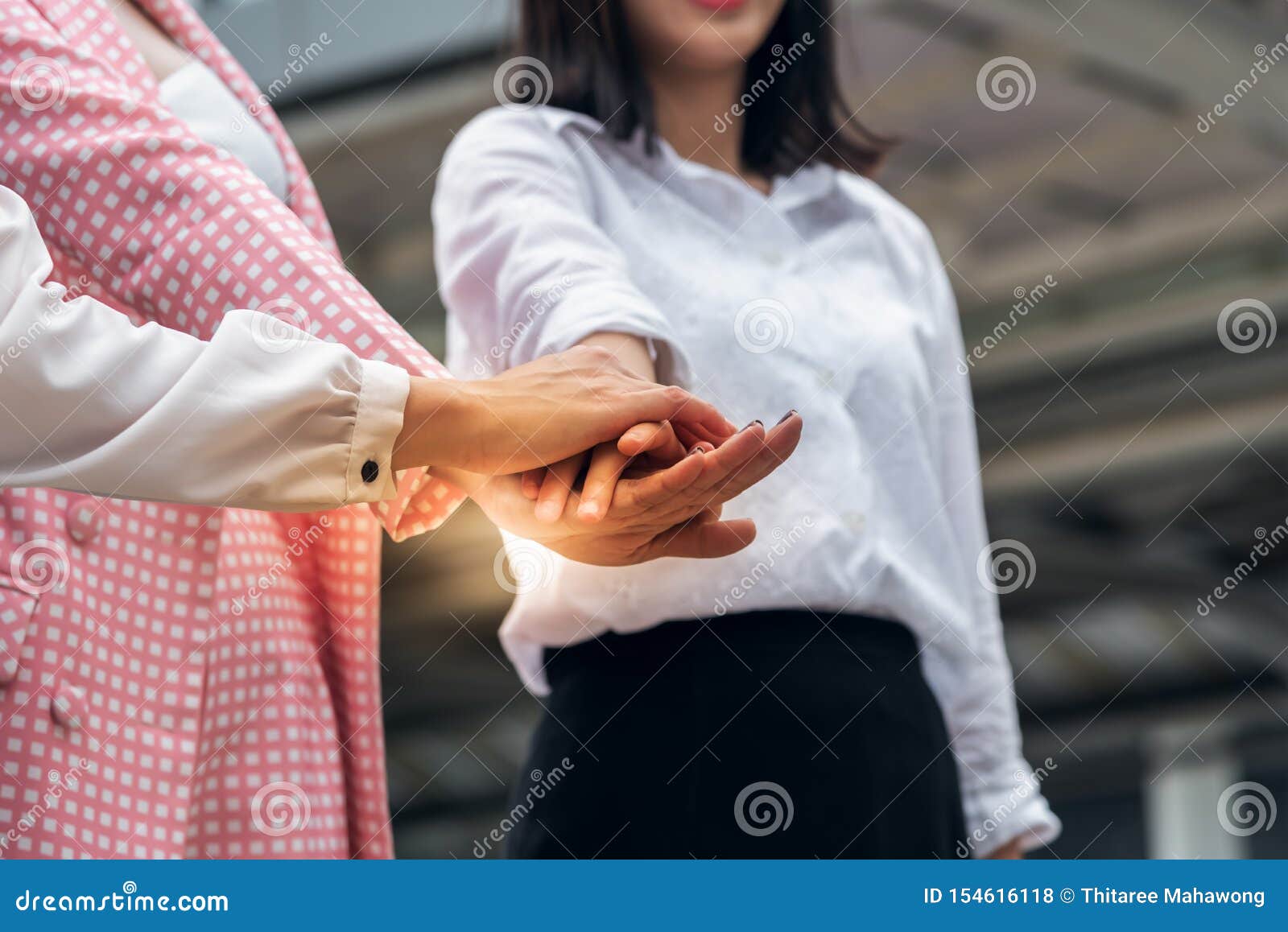 ladies joining hands ladies joining hands