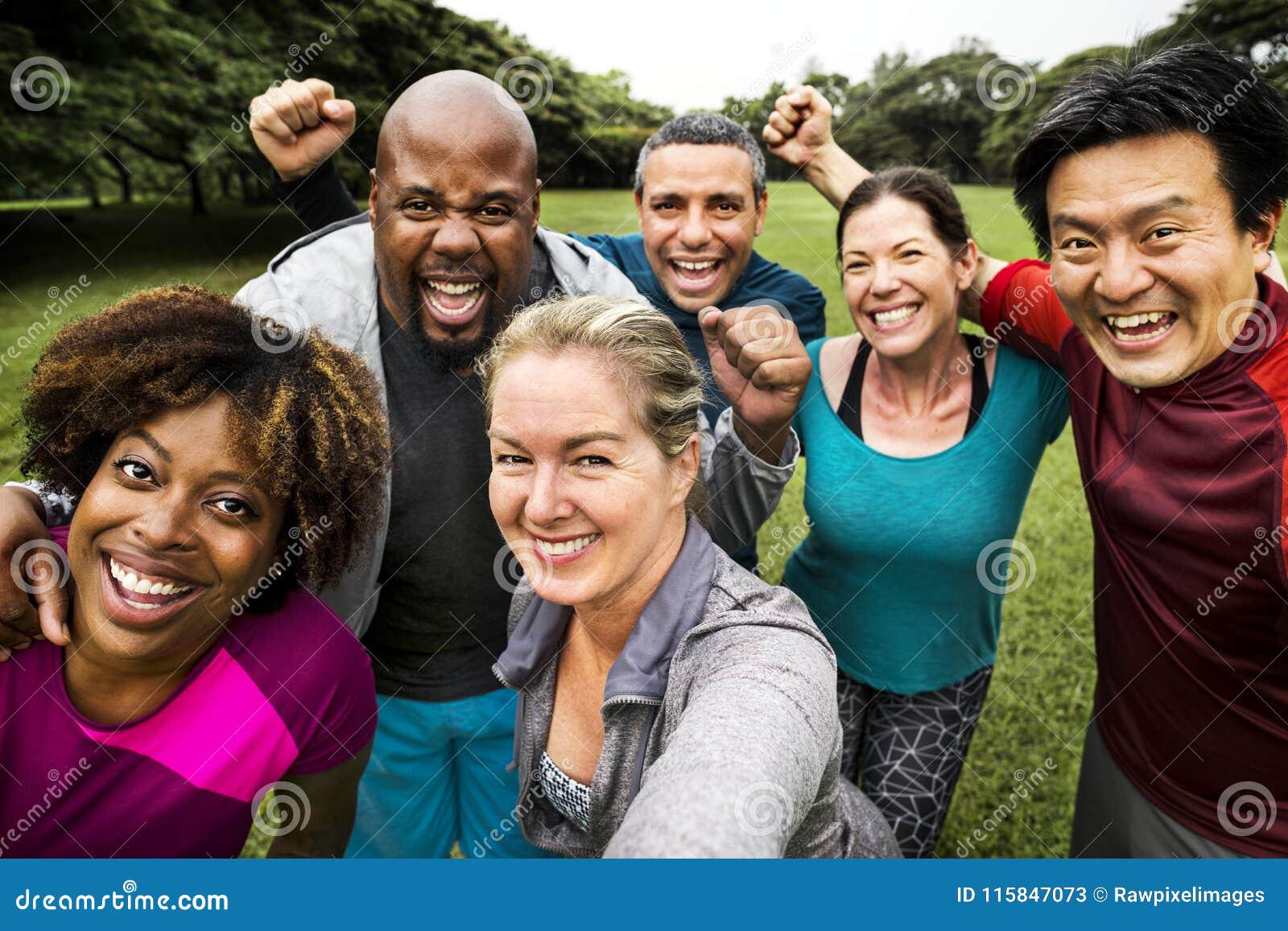 group of cheerful diverse friends in the park