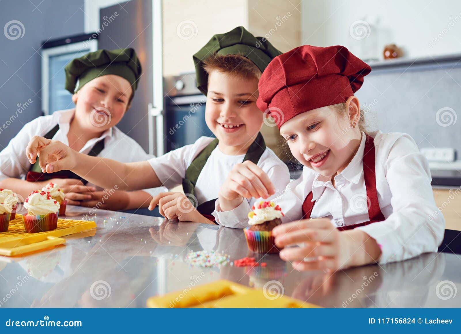 A Group of Children are Cooking in the Kitchen. Stock Photo Image of