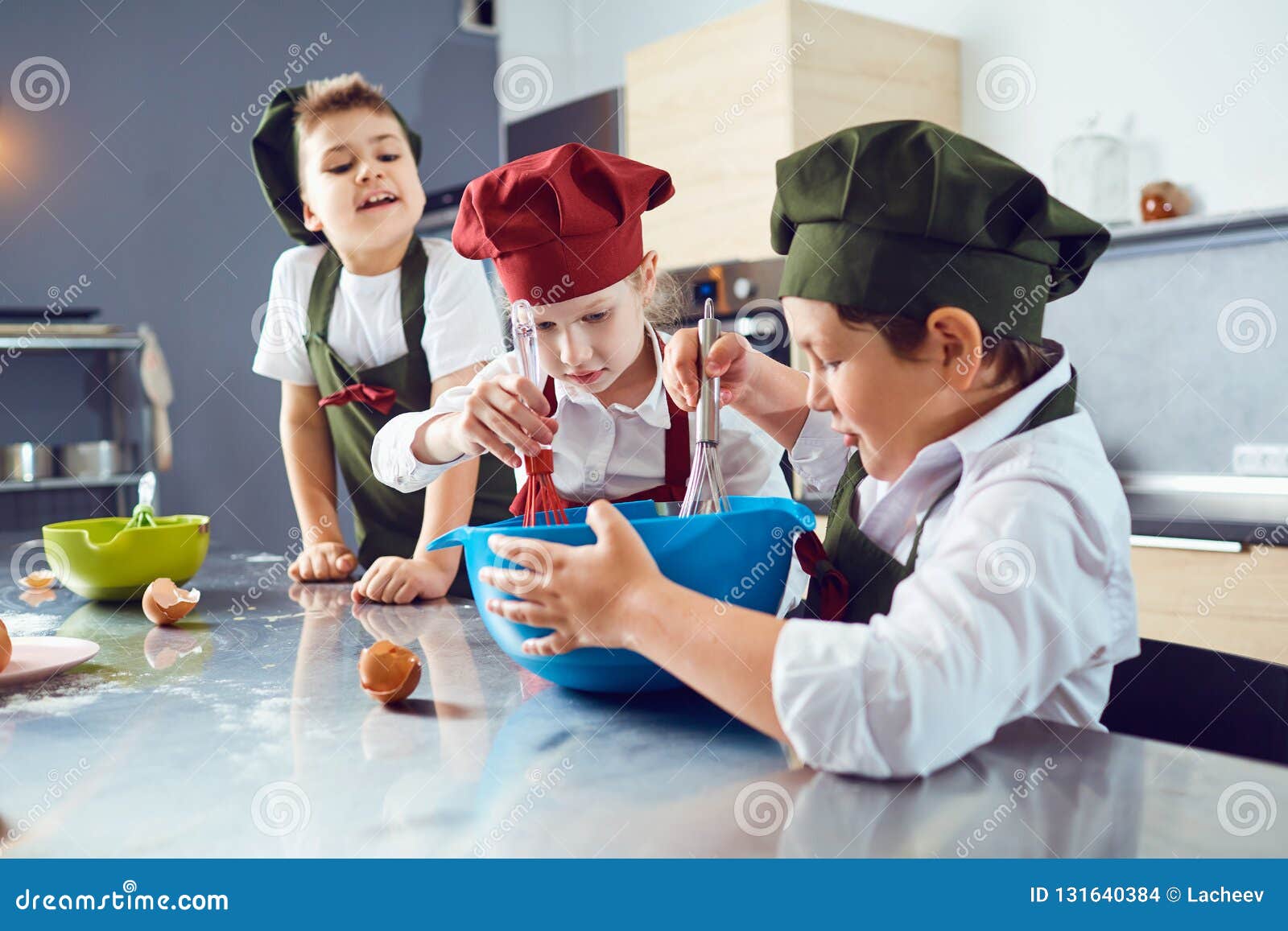 A Group of Children are Cooking in the Kitchen. Stock Photo Image of kitchen, chef 131640384
