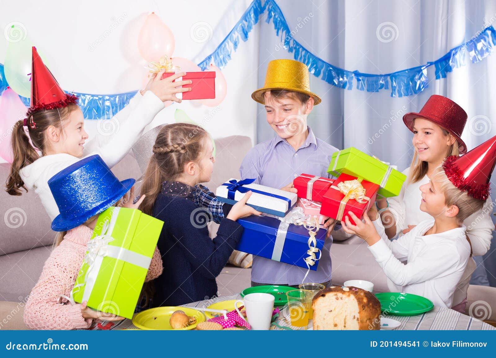 Group of Children Handing Gifts To Birthday Boy Stock Image - Image of ...