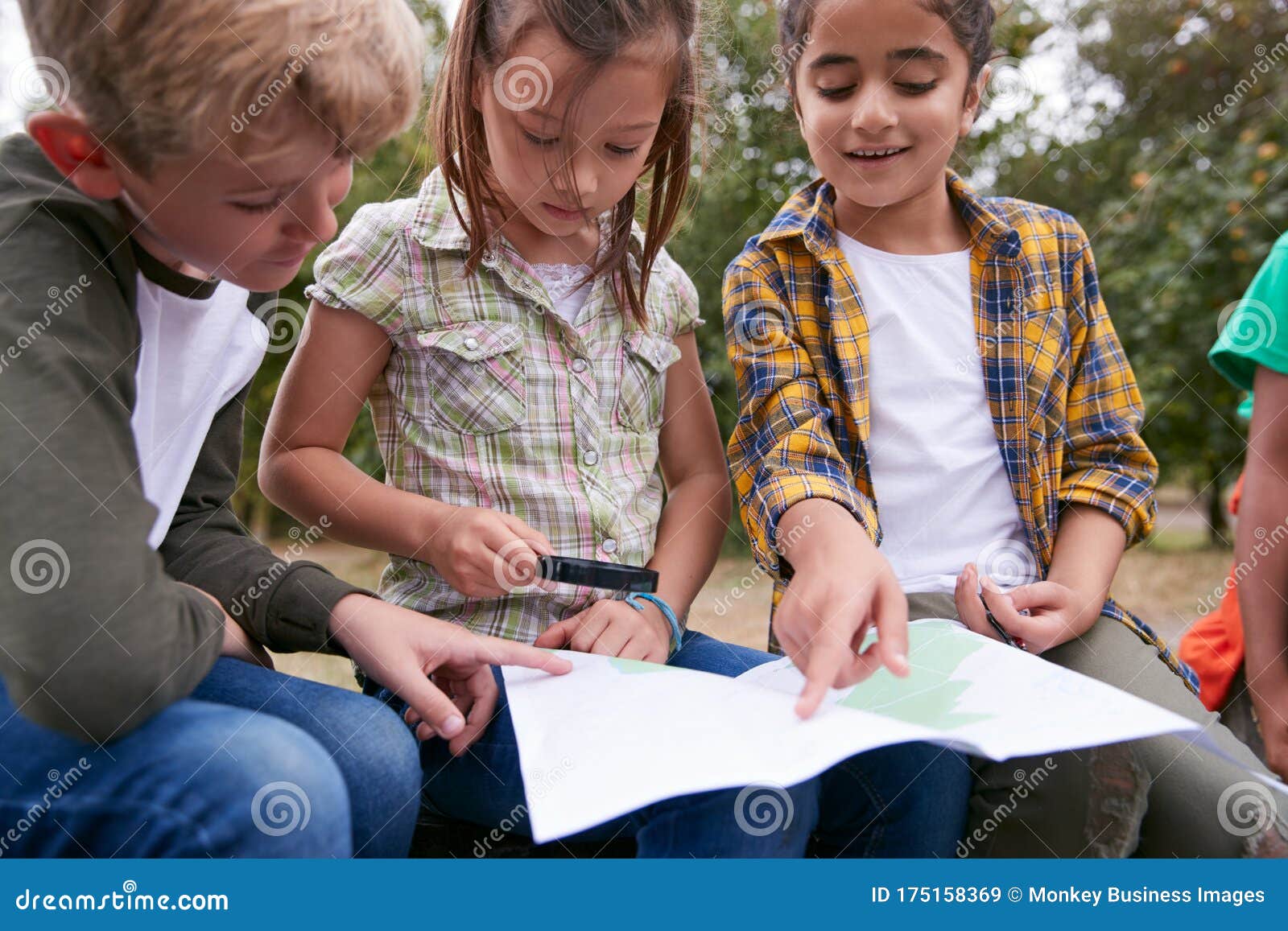 Group of Children on Outdoor Activity Camping Trip Looking at Map